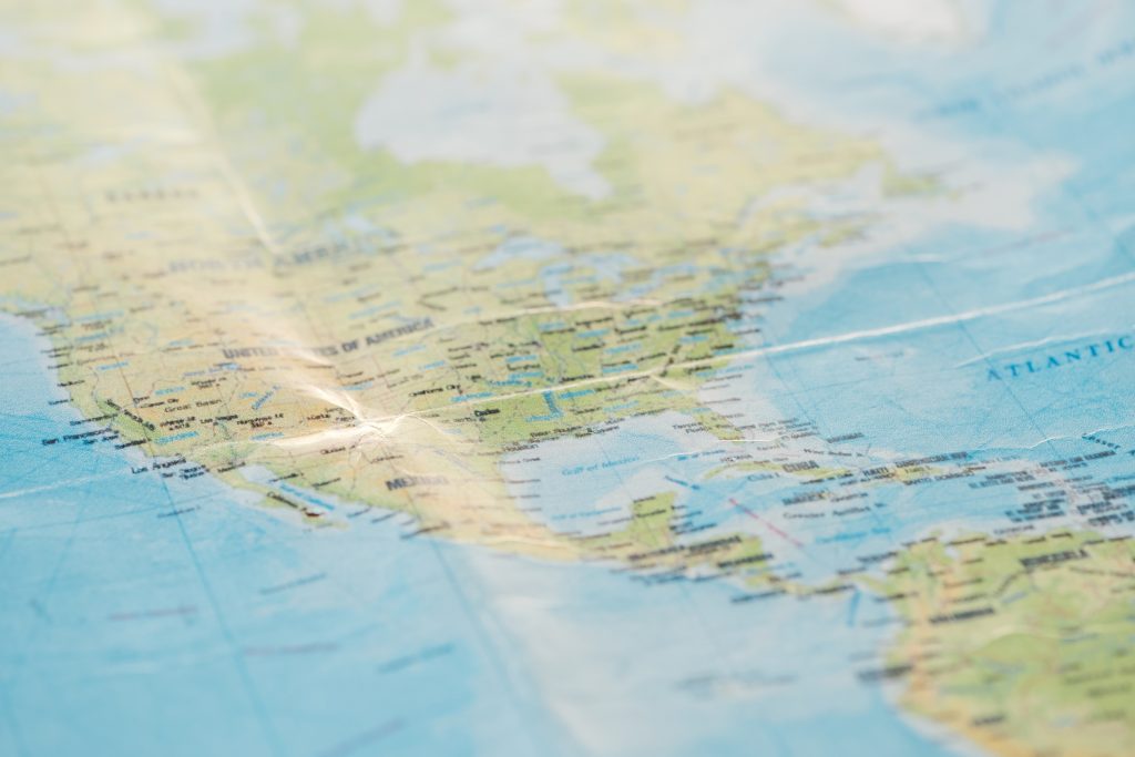 Selective focus of american continents on world map